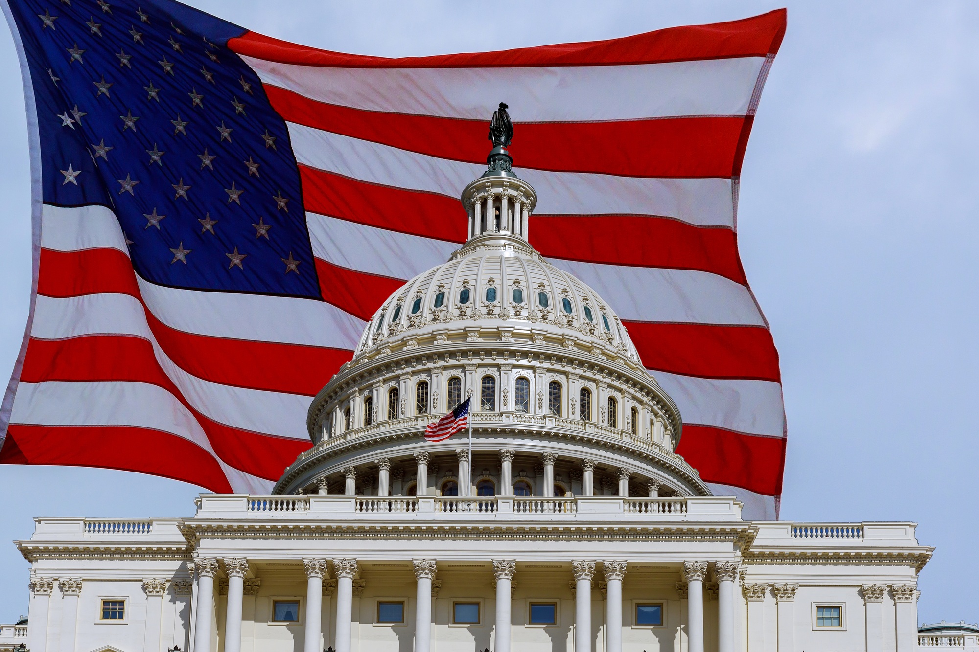 Washington DC Capitol Building on Capitol Hill detail on american flag background USA